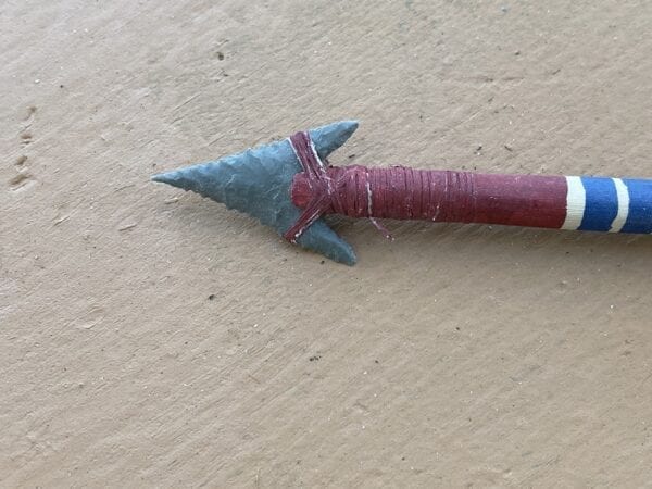 The arrow has barbed and serrated jasper projectile point